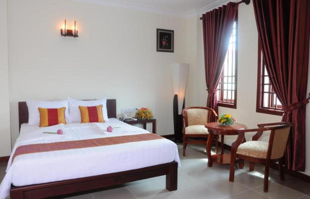 V N E Hotel Phnom Penh Quarto foto